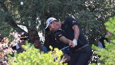 Justin Rose plays a shot on the bush of 2nd hole during the second round of the DP World Tour Championship. Kamran Jebreili / AP Photo
