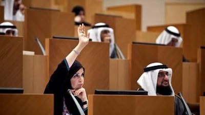 Dr Amal Al Qubaisi raises her hand to speak during the inaugural FNC session. The appointed member from Abu Dhabi was elected deputy speaker of the council.