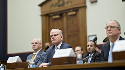 Robert Sumwalt, chairman of the National Transportation Safety Board (NTSB), from right, Daniel Elwell, acting administrator of the Federal Aviation Administration (FAA), and Earl Lawrence, executive director of aircraft certification with the Federal Aviation Administration (FAA), listen during a House Aviation Subcommittee hearing on the status of Boeing Co.'s 737 Max in Washington, D.C., U.S., on Wednesday, May 15, 2019. U.S. aviation regulators were directly involved in approving the flight-control system implicated in two fatal crashes on Boeing's 737 Max, a top administration official told Congress today, pushing back on complaints that the company had too much of a role overseeing itself. Photographer: Andrew Harrer/Bloomberg