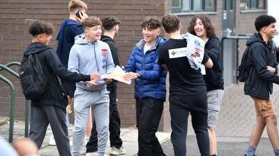 HYDE, ENGLAND - AUGUST 25: Students receive their GCSE results at Longdendale High School on August 25, 2022 in Hyde, Greater Manchester, England. This year's candidates are the first to sit exams since 2019 due to the Covid-19 pandemic and the results will likely reflect the impact of the pandemic on the nation's schoolchildren. (Photo by Anthony Devlin/Getty Images)