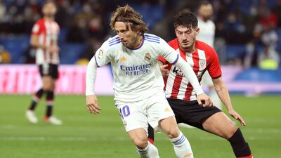 Real Madrid midfielder Luka Modric takes the ball away from Athletic midfielder Unai Vencedor. EPA