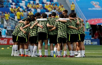South Korea players form a huddle during the warm-up before their match against Sweden. Carlos Barria / Reuters