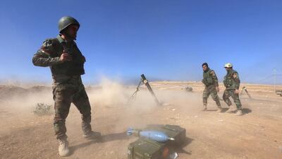 Iraqi Kurdish peshmerga fire a mortar shell from the top of Mount Zardak, about 25 kilometres east of Mosul, as they take part in the start of the operation to retake Mosul city on October 17, 2016. Safin Hamed / AFP