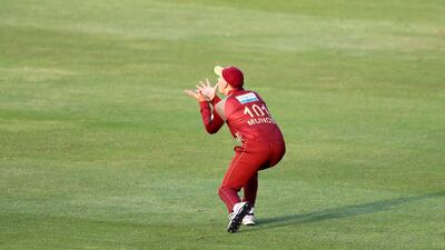 Northern Warriors' George Munsey catches out Dhabi batsman Moeen Ali. Chris Whiteoak / The National