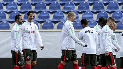 Portugal's players Hugo Almeida, left, Cristiano Ronaldo and Pepe during the team's training session in Estoril, on the outskirts of Lisbon, Portugal, 27 March 2015. Portugal will face Serbia in an Uefa Euro 2016 qualifying soccer match on 29 March. EPA/ANTONIO COTRIM
