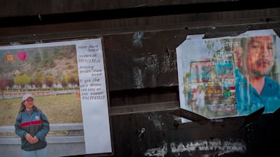 Photographs of missing people on display outside Maharajgunj Medical Campus.