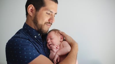 Fathers will be able to take up to five days paternal leave in the UAE after a new ruling was introduced. Getty Images