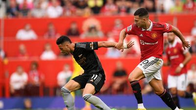 Arsenal's Brazilian midfielder Gabriel Martinelli vies with Manchester United's Portuguese defender Diogo Dalot. AFP