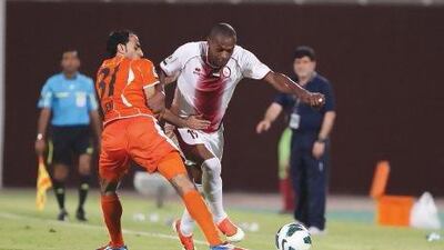 Al Wahda’s Marcelo Oliveira Da Silva, right, gets past Ajman’s Jasem Ali Mohamed on Friday night. Mustafa Raza / Al Ittihad