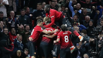 Juan Mata, number 8 jersey, celebrates with his teammates. EPA
