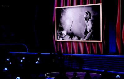 The late Taylor Hawkins appears on screen during an In Memoriam tribute at the 64th Annual Grammy Awards on Sunday, April 3, 2022, in Las Vegas. AP