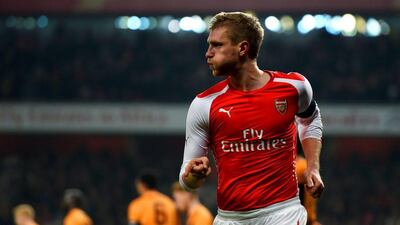 Per Mertesacker of Arsenal celebrates after scoring the opening goal in his side's 2-0 FA Cup third round win over Hull City at the Emirates Stadium on Sunday. Paul Gilham / Getty Images