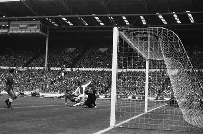 Ajax's Johan Cruyff scores in the 1971 European Cup final against Panathinaikos at Wembley. Cruyff and Ajax would complete a treble the following season. AP Photo / June 2, 1971