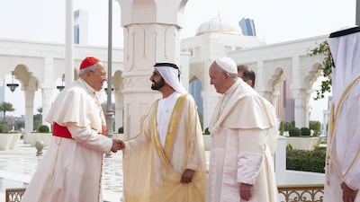 Sheikh Mohammed bin Rashid (third right) greets a member of the Vatican delegation, during a reception for Pope Francis at the Presidential Palace. Seen with Sheikh Mohamed bin Zayed (right). Mohamed Al Hammadi / Ministry of Presidential Affairs