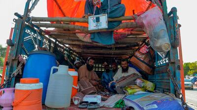 Supporters rest in a truck. AFP
