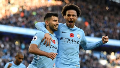 Sergio Aguero, left, scored 21 goals as Manchester City clinched the Premier League title with five games remaining. Laurence Griffiths / Getty Images