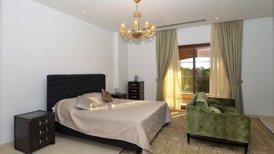 Above, one of the five bedrooms in this Dh20 millon villa at Jumeirah Islands’ Mansions. Courtesy Better Homes