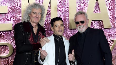 Queen drummer Roger Taylor, right, is made an OBE. EPA