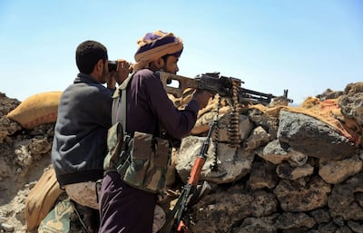 Fighters loyal to Yemen's Saudi Arabia-backed government guard a position near the frontline facing Houthi rebels in the country's north-east province of Marib, on October 17, 2021. AFP