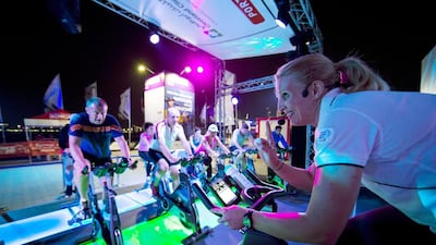 Participants take part in the 5,000 Calorie Challenge, organised by Cleveland Clinic Abu Dhabi, Healthpoint and Imperial College London Diabetes Centre, in the Volvo Ocean Race Destination Village on the Corniche breakwater in Abu Dhabi. Christopher Pike / The National