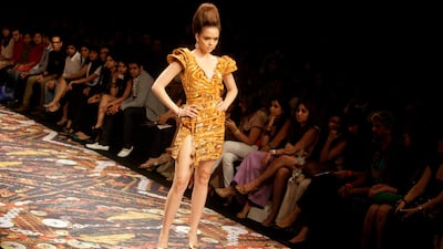 August 19, 2011: An Indian model displays creations by designer Pria Kataaria Puri during the Lakme Fashion Week. AP Photo/Rajanish Kakade