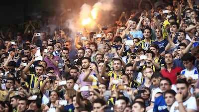 Fenerbahce fans celebrate as Robin Van Persie, of Netherlands, is presented at the team’s Sukru Saracoglu Stadium in Istanbul, Tuesday, July 14, 2015. The 31-year-old former Arsenal, Feyenoord and Manchester United striker links up with his former United teammate Nani, who signed for the Istanbul club last week. Lefteris Pitarakis / AP
