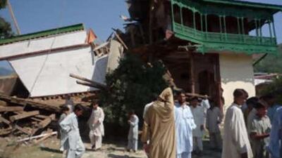 Residents gather at the site of a bomb blast in the troubled Swat region on Monday. Officials in the tribal regions are hopeful the latest military operations in the area signalled a new resolve from the army to combat militancy.