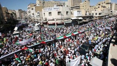 Jordanians calling for political change and an end to corruption protest in front of Al Husseini Mosque in Amman on Friday.