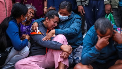 People mourn at a relative's cremation ritual in Kathmandu, Nepal on Wednesday. Reuters