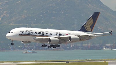 A Singapore Airlines aircraft comes in to land at Hong Kong's international airport. The carrier is to use an A350-900 on its service to Houston via Manchester. Mike Clarke / AFP