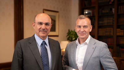 Mohammed Alardhi, executive chairman of Investcorp, and The National's Manus Cranny