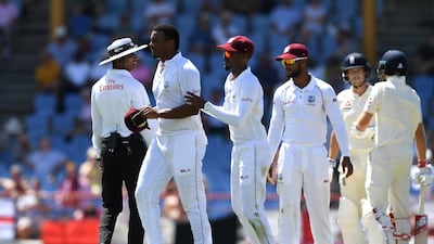 Shannon Gabriel, left, of the West Indies is ushered away by Kraigg Brathwaite after confronting England batsmen Joe Root and Joe Denly. Getty