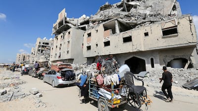 Palestinians flee Hamad City in Khan Younis, southern Gaza, following an Israeli evacuation order. Reuters