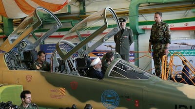 A handout picture shows President Hassan Rouhani in the cockpit of the "Kowsar" fighter jet, believed to be 100 per cent Iranian made, on August 21, 2018. AFP Photo