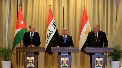 Iraqi Foreign Minister Fuad Hussein, centre, Egyptian Foreign Minister Sameh Shoukry, right, and Jordanian Foreign Minister Ayman Safadi in Baghdad, Iraq. EPA