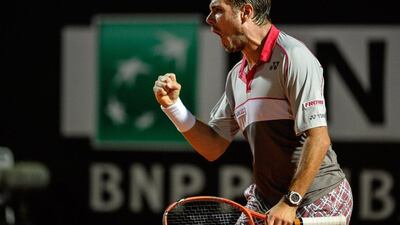 Stanislas Wawrinka roars in delght after defeating Rafael Nadal in the Italian Open quarter-finals. Andreas Solaro / AFP