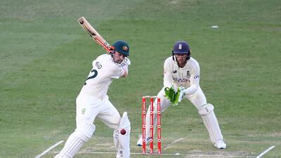 Australia's Travis Head plays a shot in front of England's Jos Buttler. AFP