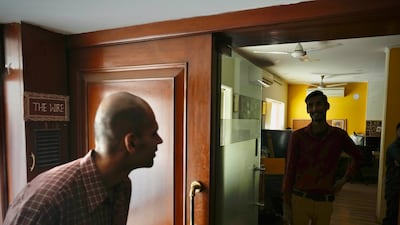 A visitor outside the office of 'The Wire', an independent local news website, in New Delhi. Amit Malviya, the IT head of India’s ruling Bharatiya Janata Party, said he would file civil and criminal charges against the website after it reported in a now-retracted story that the US social media giant Meta had granted him extraordinary powers to censor Instagram posts. AP