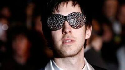 Calvin Harris poses for photographers as he arrives for the Brit Awards at Earls Court in London in February this year.
