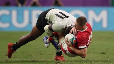 Wales' Liam Williams in action with Fiji's Semi Radradra - Pool D - Wales v Fiji - Oita Stadium, Oita, Japan. REUTERS/Peter Cziborra