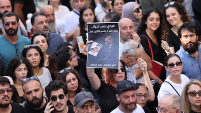 Mourners gather around the hearse carrying the remains of the Lebanese musician, composer and writer, outside Khoury Hospital in Beirut's central Hamra district. AFP
