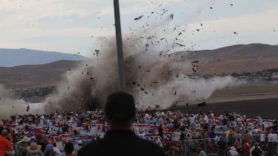 A P-51 Mustang airplane crashes into the edge of the grandstands at the Reno Air show on Friday, Sept. 16, 2011 in Reno Nevada. The World War II-era fighter plane flown by a veteran Hollywood stunt pilot Jimmy Leeward plunged Friday into the edge of the grandstands during the popular air race creating a horrific scene strewn with smoking debris. (AP Photo/Ward Howes) *** Local Caption *** APTOPIX Air Show Crash.JPEG-08a21.jpg