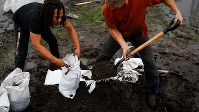 Residents fill up sandbags ahead the expected arrival of Hurricane Nicole in Daytona Beach. Reuters
