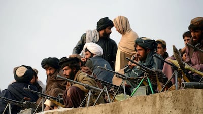 Afghan Taliban fighters listen to an unseen Mullah Mohammad Rasool Akhund, the newly appointed leader of a breakaway faction of the Taliban, at Bakwah in the western province of Farah on November 3, 2015. Javed Tanveer/AFP