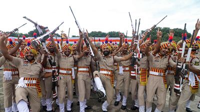 Punjab state police officers celebrate after winning the trophy for overall best march past, at an event marking Independence Day in Chandigarh, capital of the northern states of Punjab and Haryana. AFP