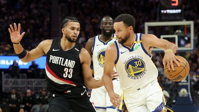 Steph Curry of the Golden State Warriors is guarded by Toumani Camara of the Portland Trail Blazers during their preseason game at the Chase Centre in San Francisco. AFP