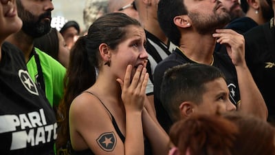 Botafogo fans cry as they watch the match against Mexico's Pachuca at the historical headquarters of Botafogo, named General Severiano, in Rio de Janeiro. AFP
