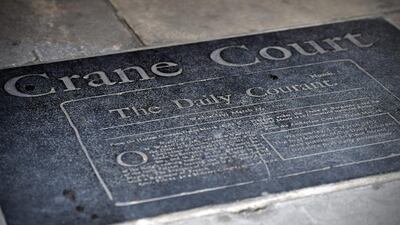 A plaque detailing the history of the Daily Courant, London's first daily newspaper, is displayed at the entrance to Crane Court off Fleet Street. For decades Fleet Street was the home of Britain's biggest newspapers. Carl Court / Getty Images