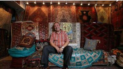 "When you buy something you like, you sell it also with love," says Attif Hellal, the owner of Tabriz Carpet and Novelty Exhibition, at his store in the Central Market in Sharjah.