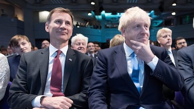 Boris Johnson beat Jeremy Hunt, left, with more than two-thirds of the votes to determin the UK's new leader. Reuters